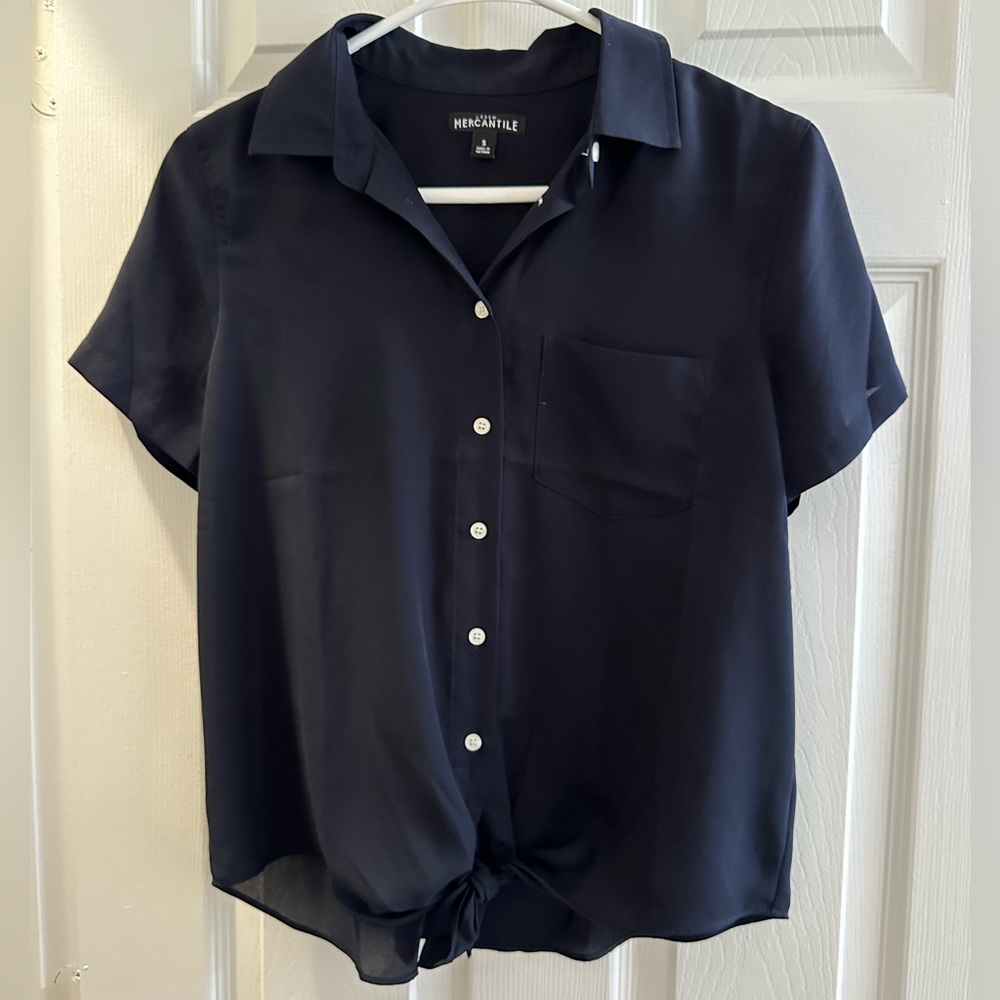 J. Crew. Size small. Navy. Collar short sleeve, buttons, ties at the bottom.